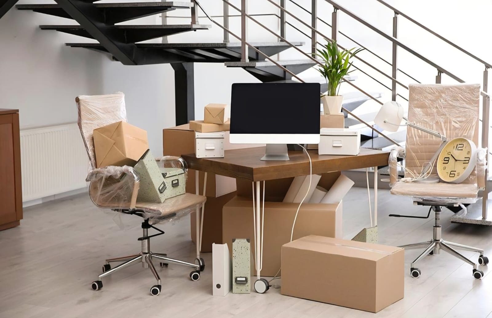 Carefully wrapped and packed office furniture ready for relocation